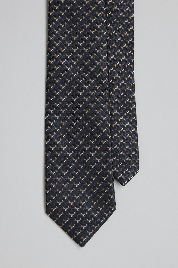 A close-up of the Barkers Malvern Pattern Tie, a dark silk tie featuring a repeating pattern of light dachshund silhouettes, laid flat on a light gray background—ideal for adding character to your business look.