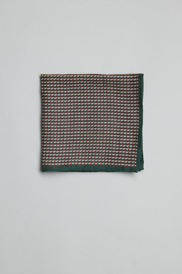 Parisian Geo Linen Pocket Square in dark green with small red and white geometric pattern.
