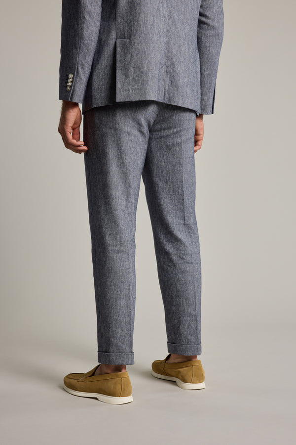 Man wears Barkers Paden Twill Pant, blue, shown from the back against a plain background.