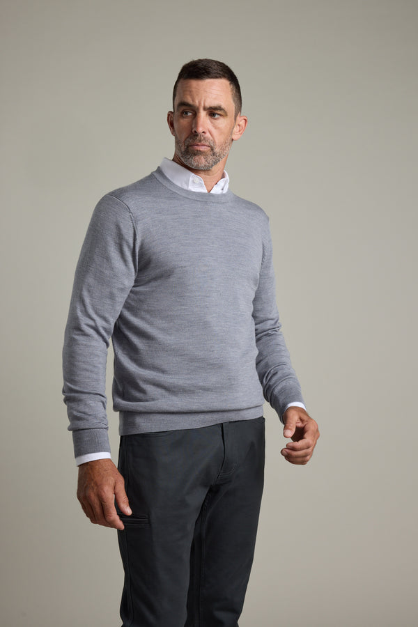 Man in Barkers Skyland ZQrx Merino Crew, standing against a plain light background.