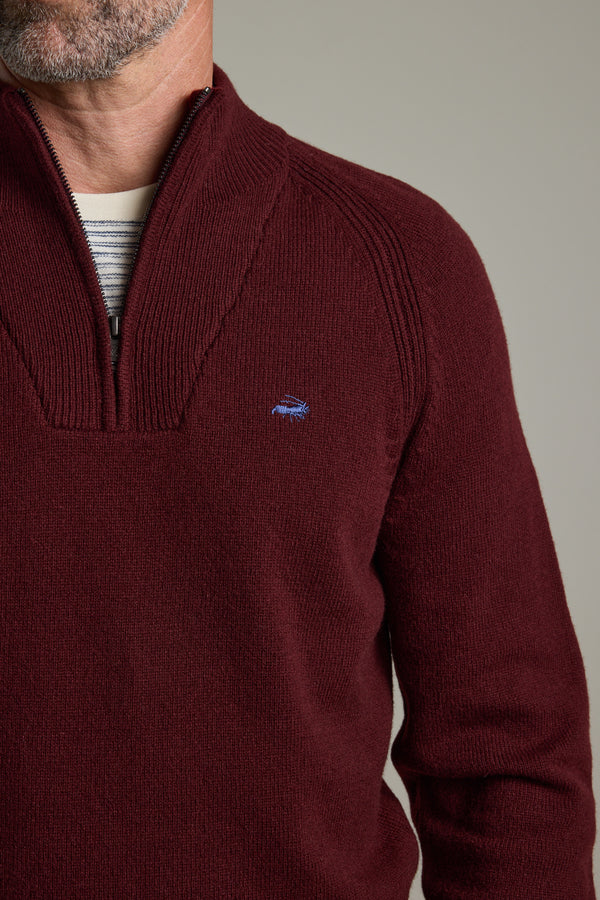Man in Barkers Rowley Woollen 1/4 Zip sweater over a striped shirt, shown shoulders down.