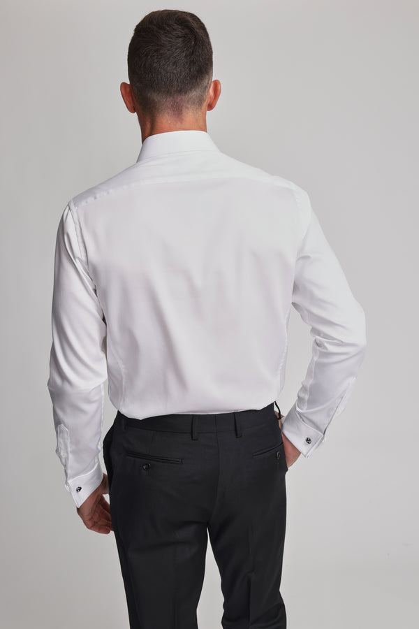 A man with short hair is seen from the back, wearing the Barkers Tribeca French Cuff Shirt and black dress pants against a plain, light-colored background.