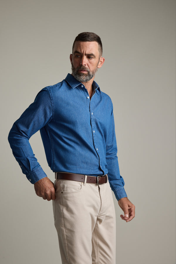 Man wears Barkers Wyatt Denim Business Shirt, eco easy care, against a plain background.