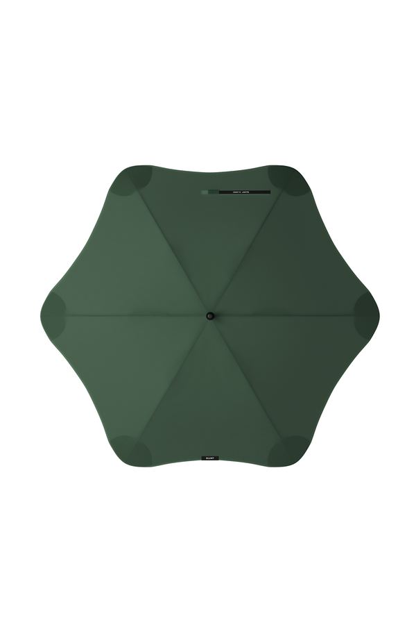 Top-down view of the Blunt Classic Umbrella in dark green, featuring a unique wavy-edged design. This full-length Blunt umbrella provides stylish rain protection against a white background.