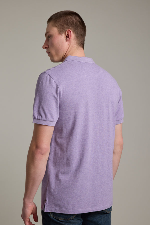 A man in a Barkers Regent Pique Polo faces away, glancing over his left shoulder.