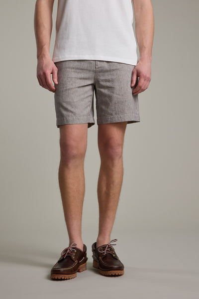 A person wearing a white t-shirt, Barkers Woodley Weekend Short with an elastic waistband, and brown boat shoes stands against a plain background. The image is cropped from the shoulders down.