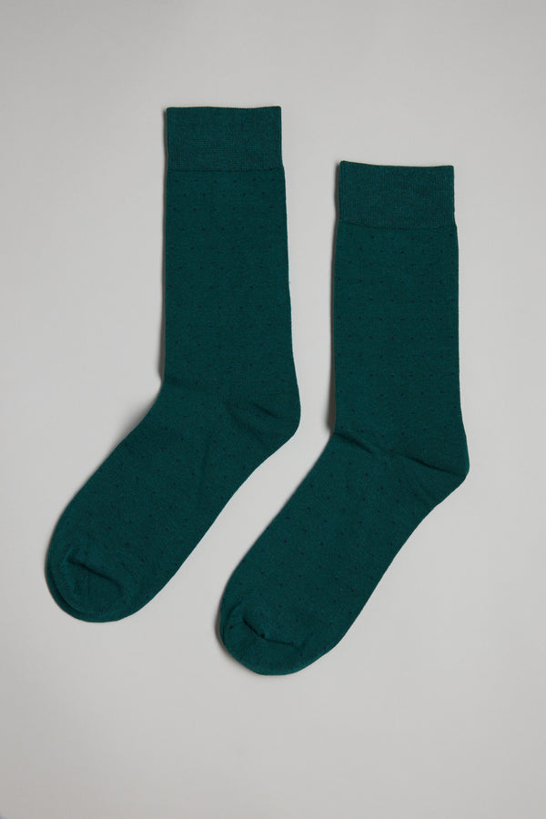 The Barkers Mercer Dot Sock is a comfortable pair of dark green cotton socks with a subtle pin-dot pattern, shown laid flat on a light gray background.