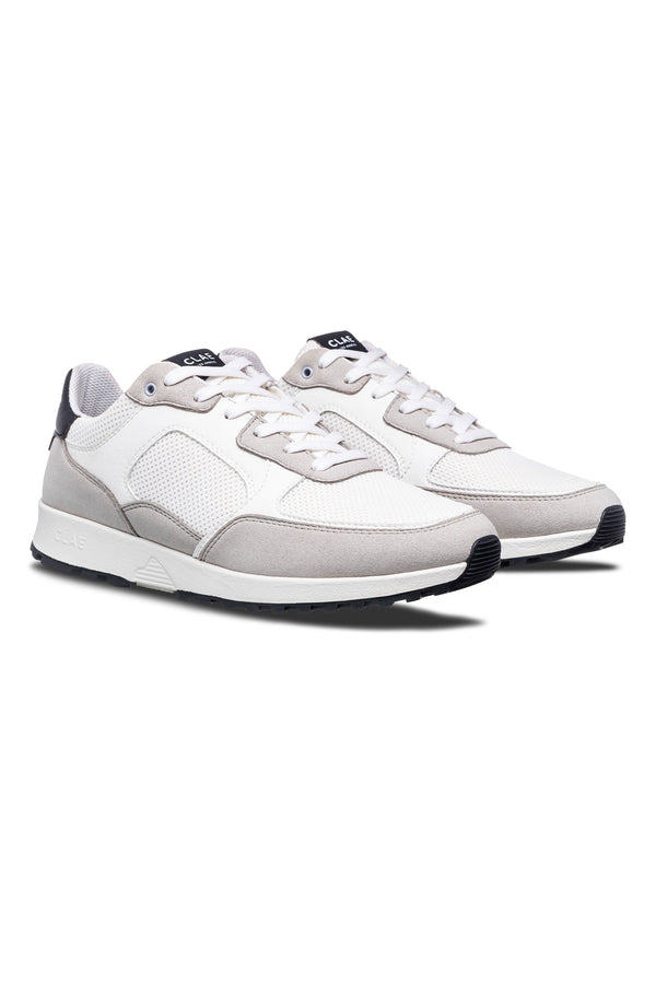 The Clae Joshua sneakers by Clae, featuring white and light gray sustainable materials, mesh panels, suede accents, and white laces, are displayed side by side on a white background.
