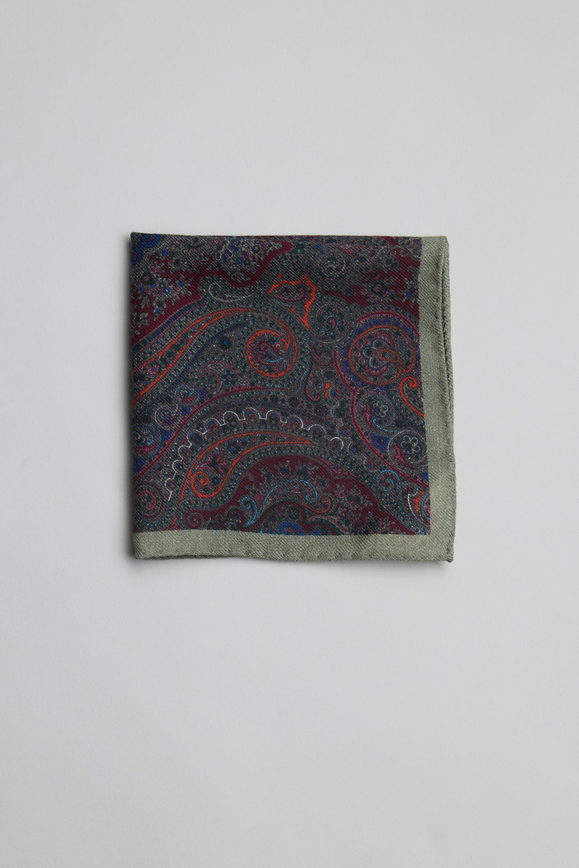 Parisian Paisley Wool Pocket Square in dark blue, red & grey on white background.