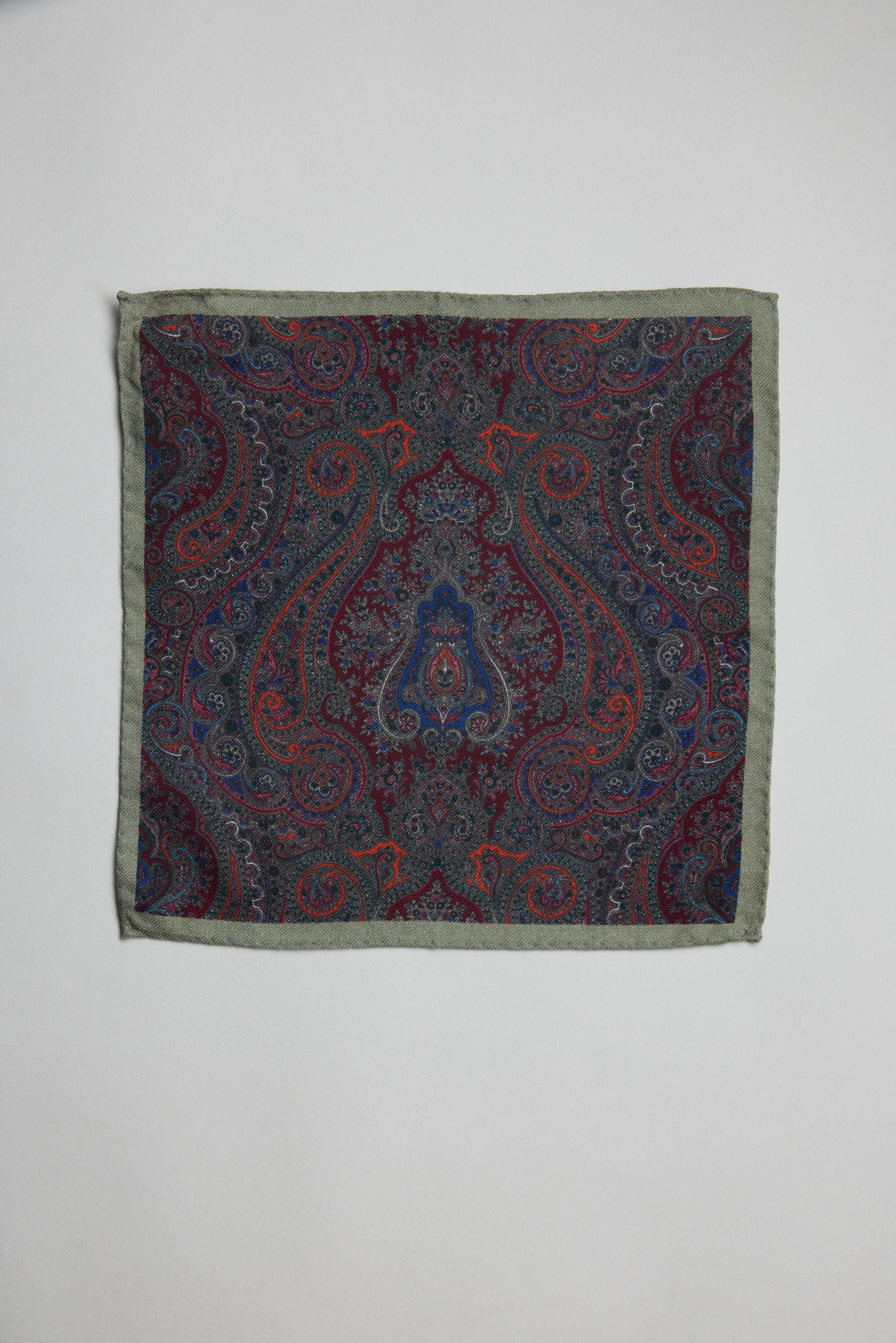 Parisian Paisley Wool Pocket Square in blue, red, and green on white by Parisian.