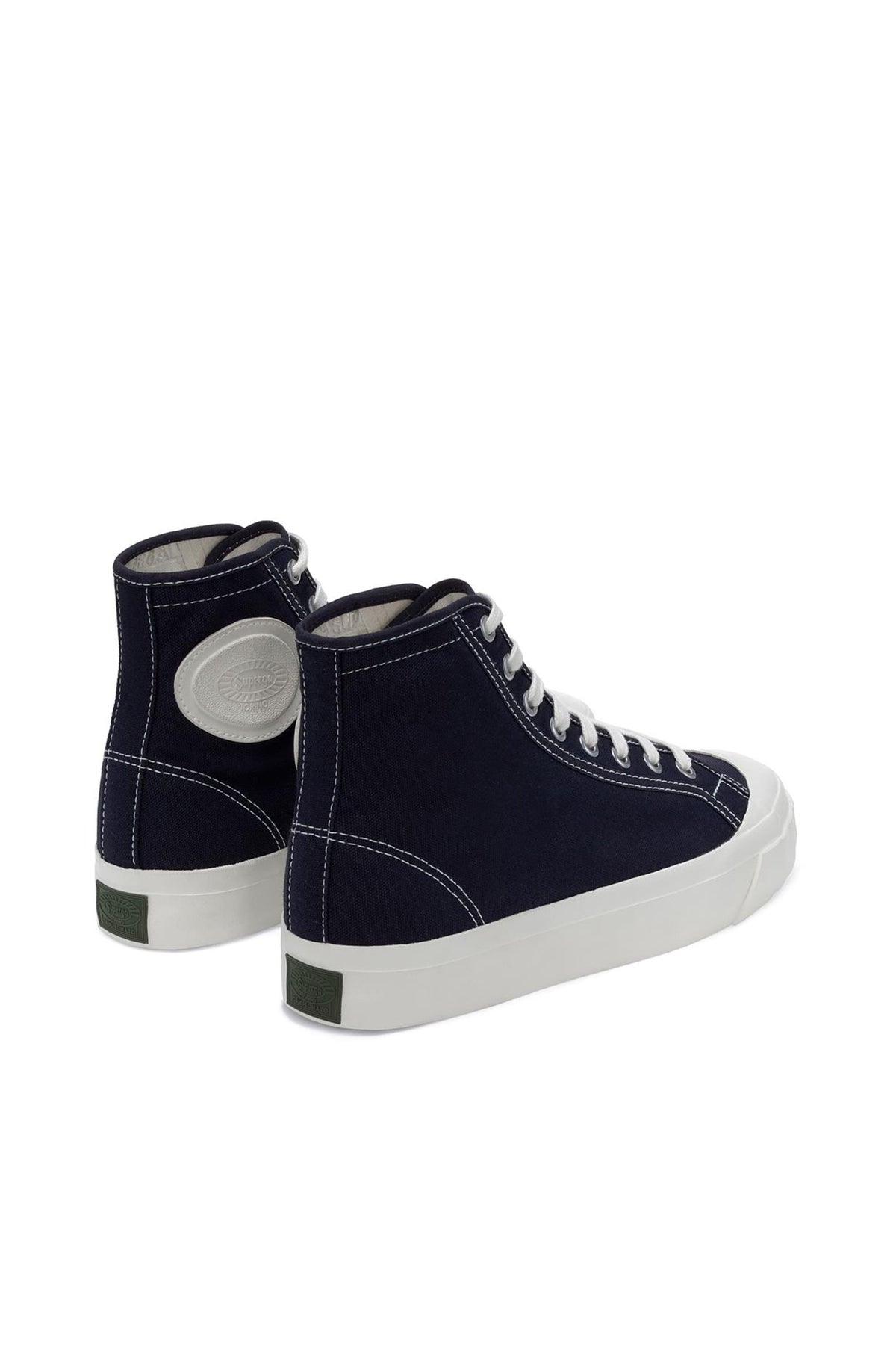 A pair of Superga Campinato Basket high-top sneakers by Superga in navy blue with vulcanized rubber outsoles, white soles and laces, classic stitching, and a circular white logo patch near the heel, angled on a white background.