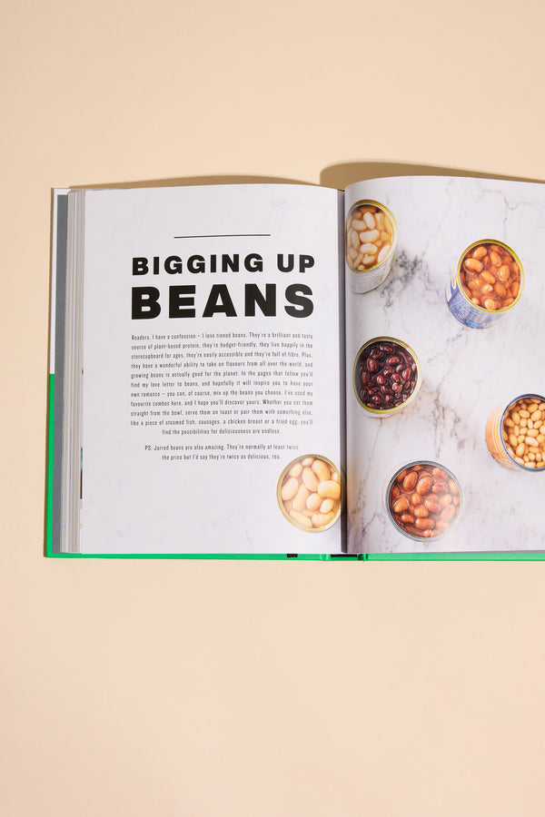 An open Simply Jamie cookbook by Other rests on a beige surface, featuring recipes and vibrant photos of white beans, black beans, and chickpeas in bowls and cans. Ideal for quick midweek meals.