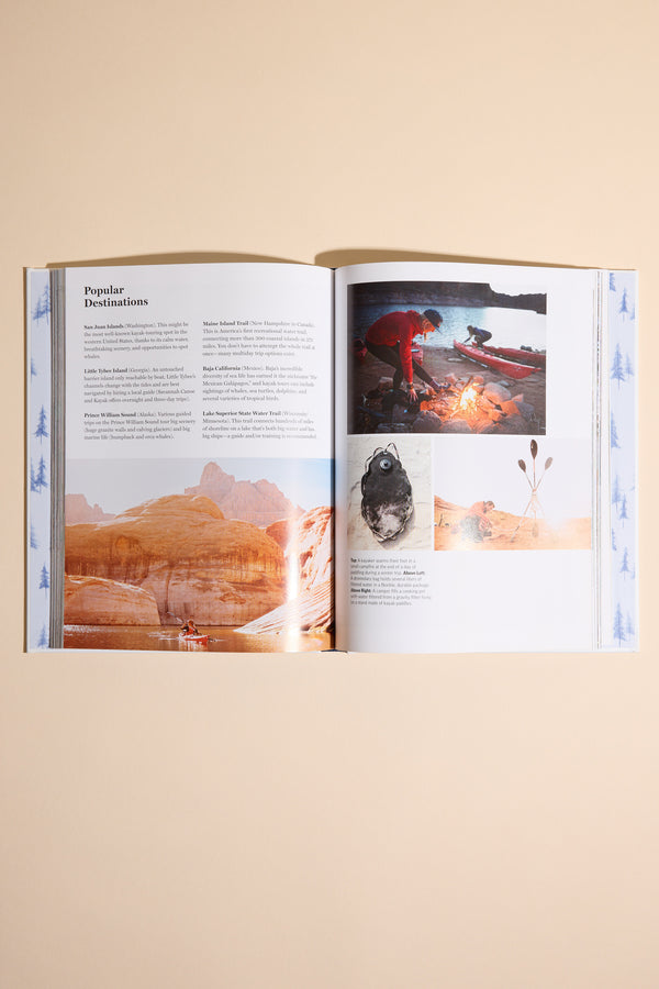 An open "Camping Life" book by Other shows a page with info on top destinations and four photos: red rocks, campfire camping, a cooked fish, and plants. The book rests on a plain beige background.