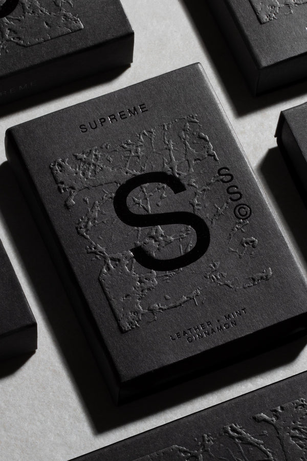 Solid State - Supreme by Solid State comes in a black rectangular box with a large embossed S and textured design. This wax-based cologne provides a long-lasting scent featuring notes of leather, mint, and cinnamon.