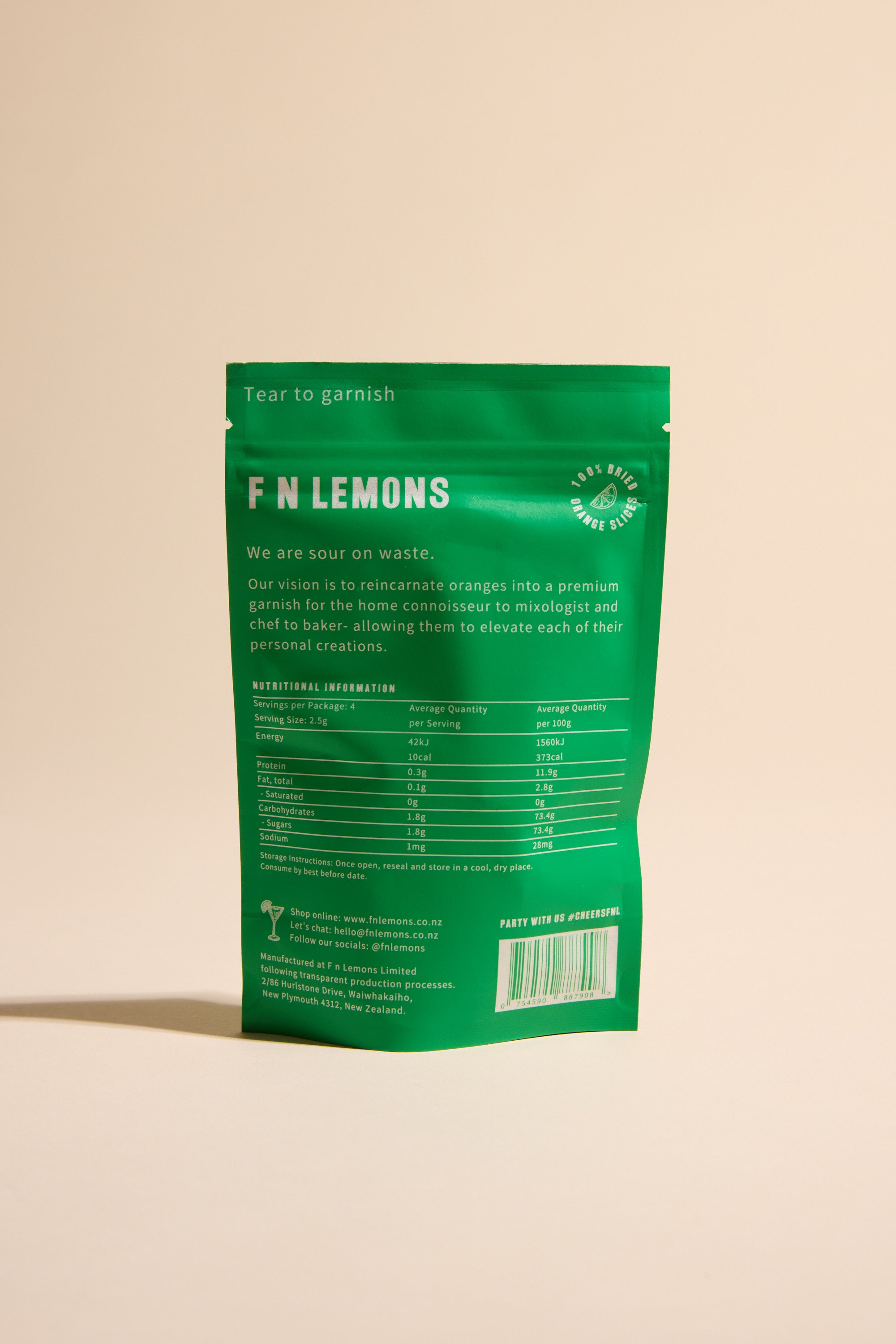 A green resealable pouch labeled “F N Lemons - Limes 10 Slice Pouch” stands upright on a beige surface, showing white nutritional info and product details—ideal as a premium garnish for baking or cocktails.