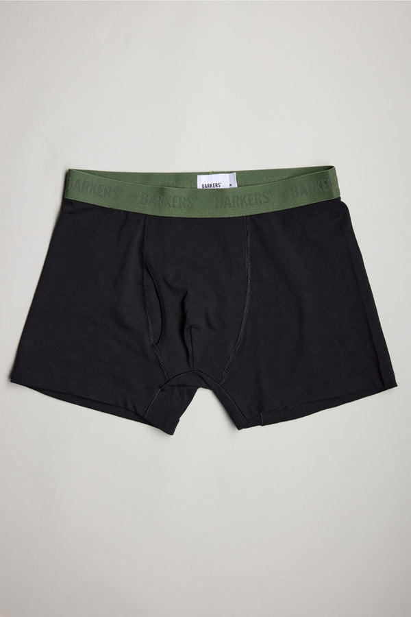 A pair of black Barkers 3-Pack Organic Trunk men's underwear with a green BARKERS-logo waistband, shown flat on a light background.
