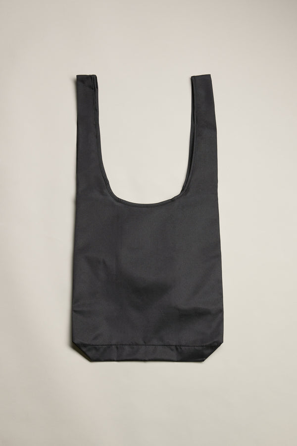 The Barkers Shopping Bag by Barkers is a durable, black recycled polyester tote with two wide handles—laid flat on a light beige background, it's perfect for everyday use.