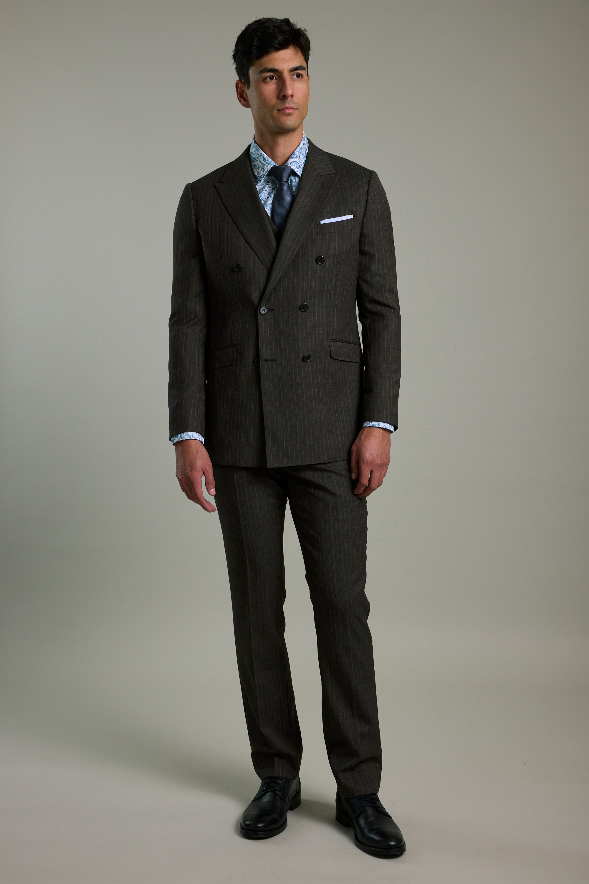 Man in a Barkers Radcliffe Stripe Double Breasted Suit Jacket, standing against a plain background.