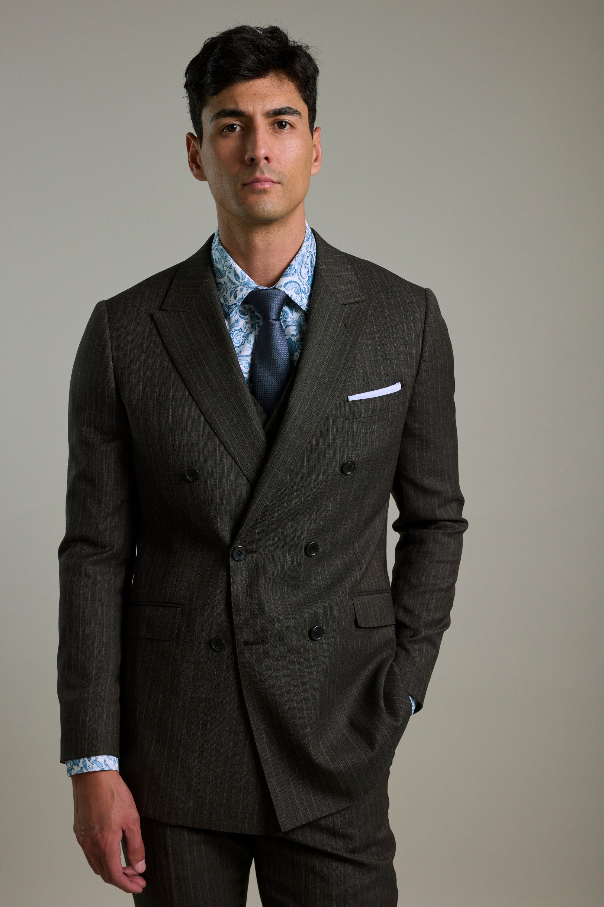 Man in Barkers Radcliffe Stripe Double Breasted Suit Jacket with blue tie and patterned shirt.