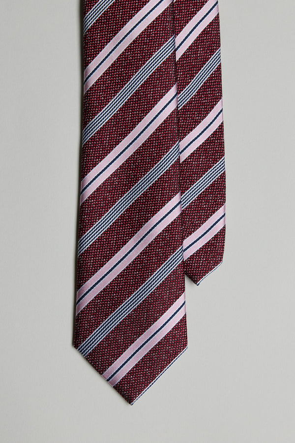 The Gracie Stripe Tie by Barkers is shown in a close-up, featuring maroon with light pink and dark gray diagonal stripes against a plain light gray background.