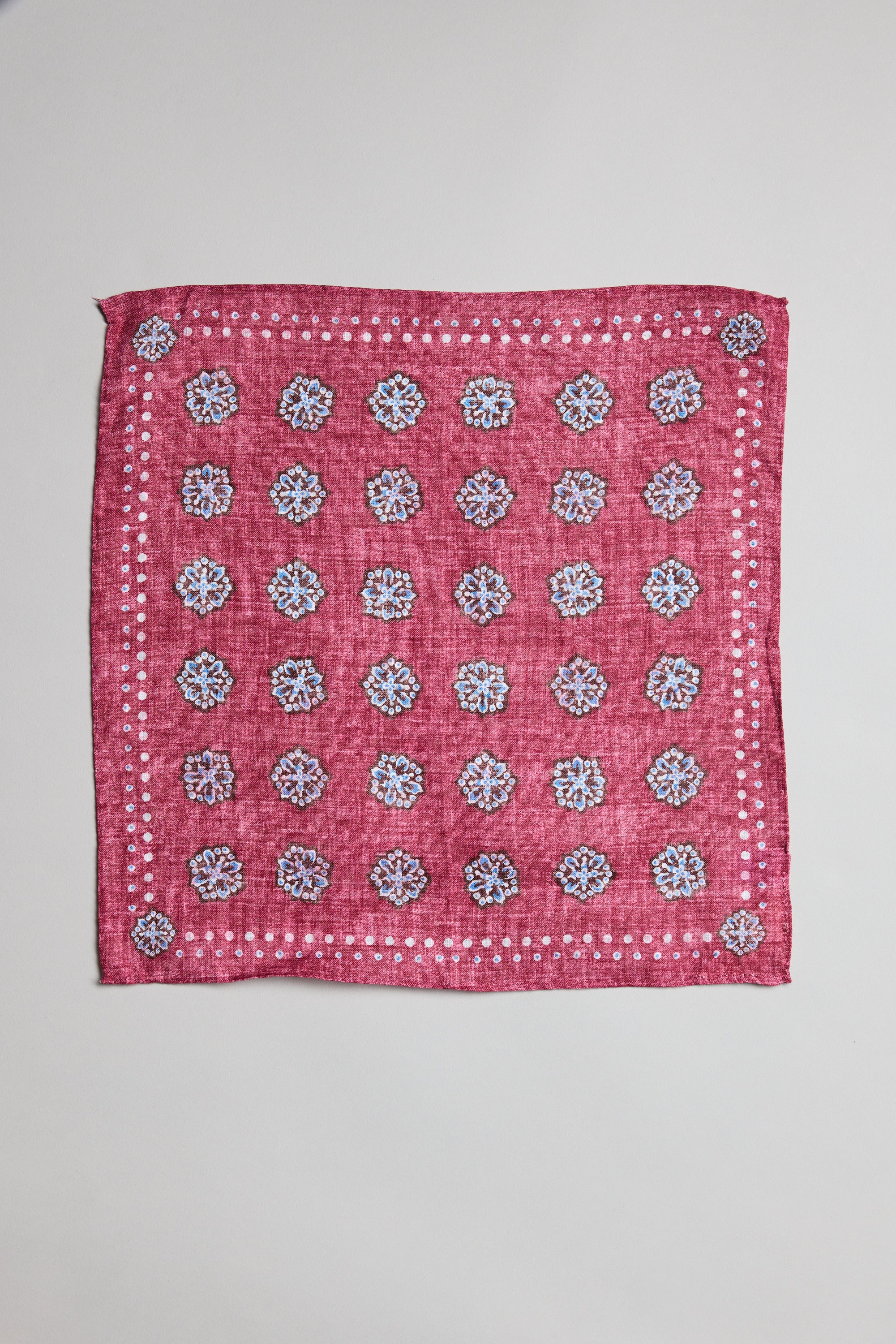 Parisian Motif Linen Pocket Square by Parisian with white and blue floral and dotted borders.