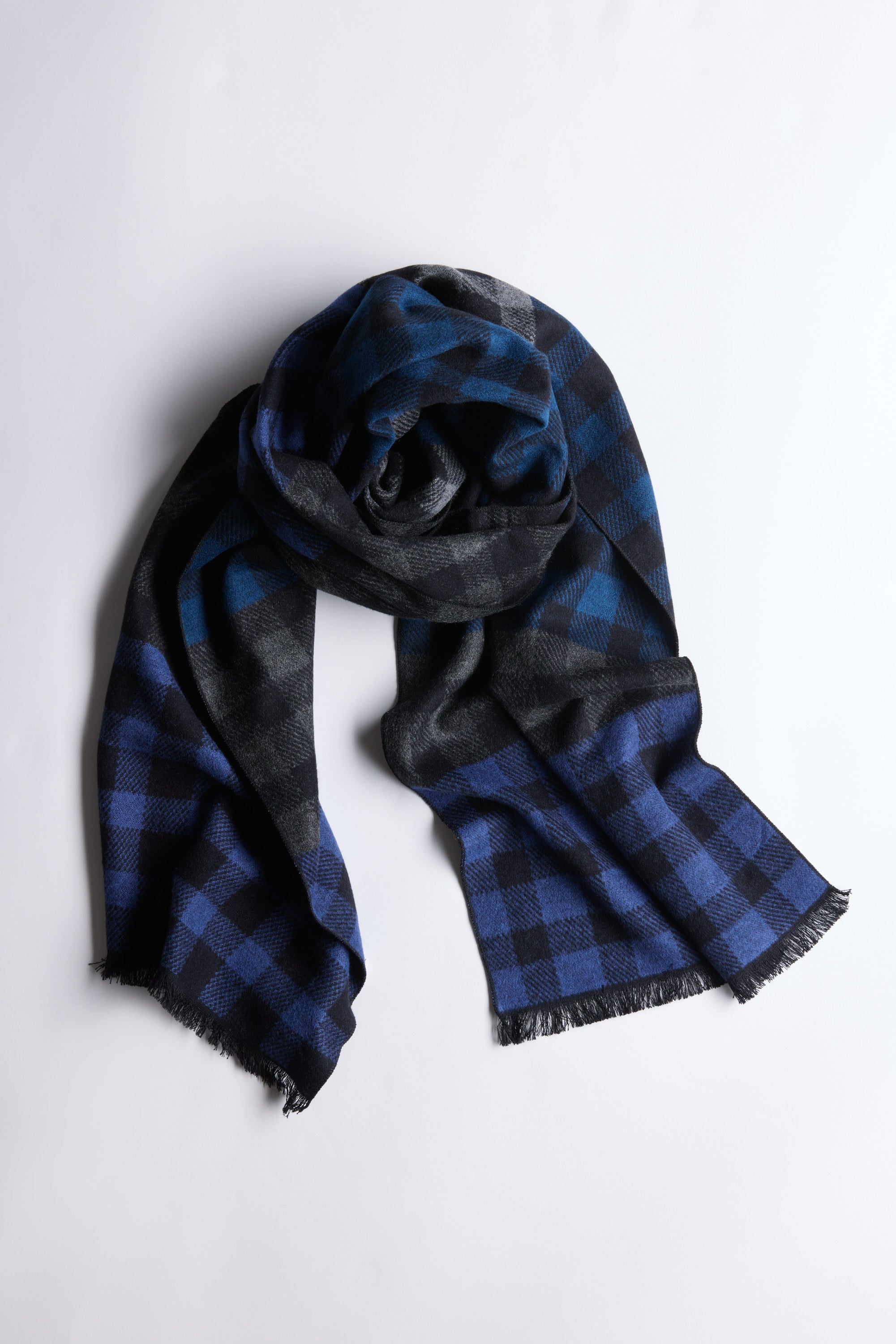 Barkers Harper Scarf in blue and black check with fringed ends, made from 100% rayon.