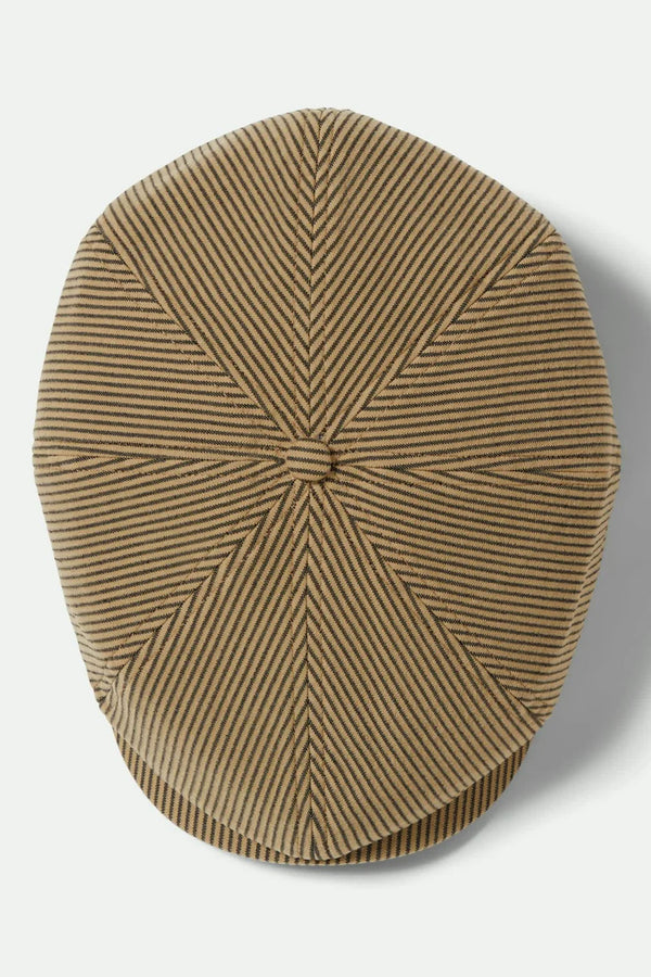 The Brixton Brood Snap Cap by Brixton features a brown and black hickory stripe pattern, classic newsboy shape, geometric sectioning with visible seams, and a central button for an authentic vintage style.
