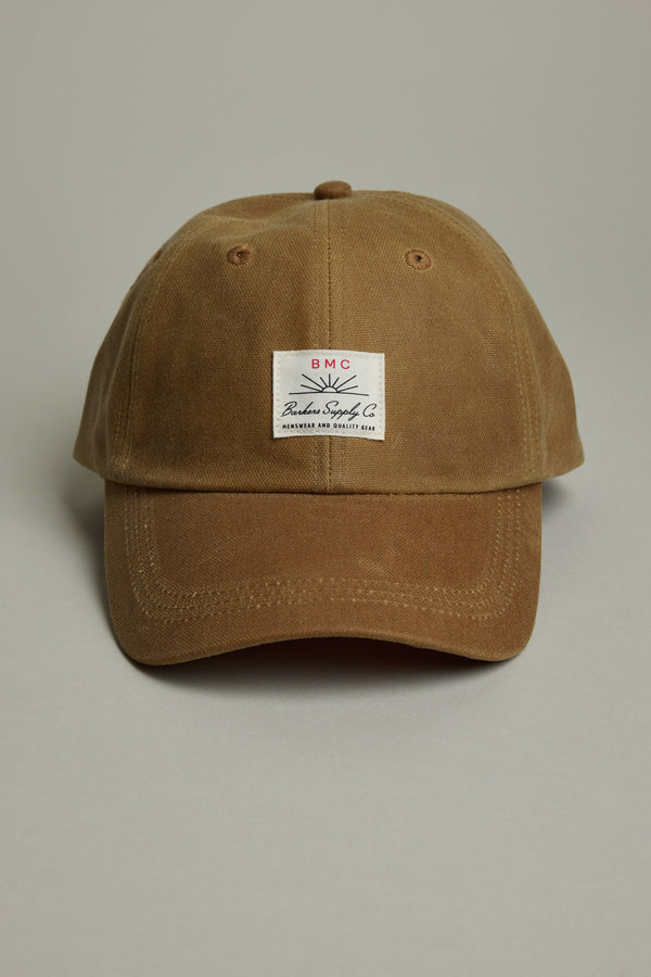 Barkers Benson Waxed Cotton Cap with heritage patch, adjustable fit on a plain background.