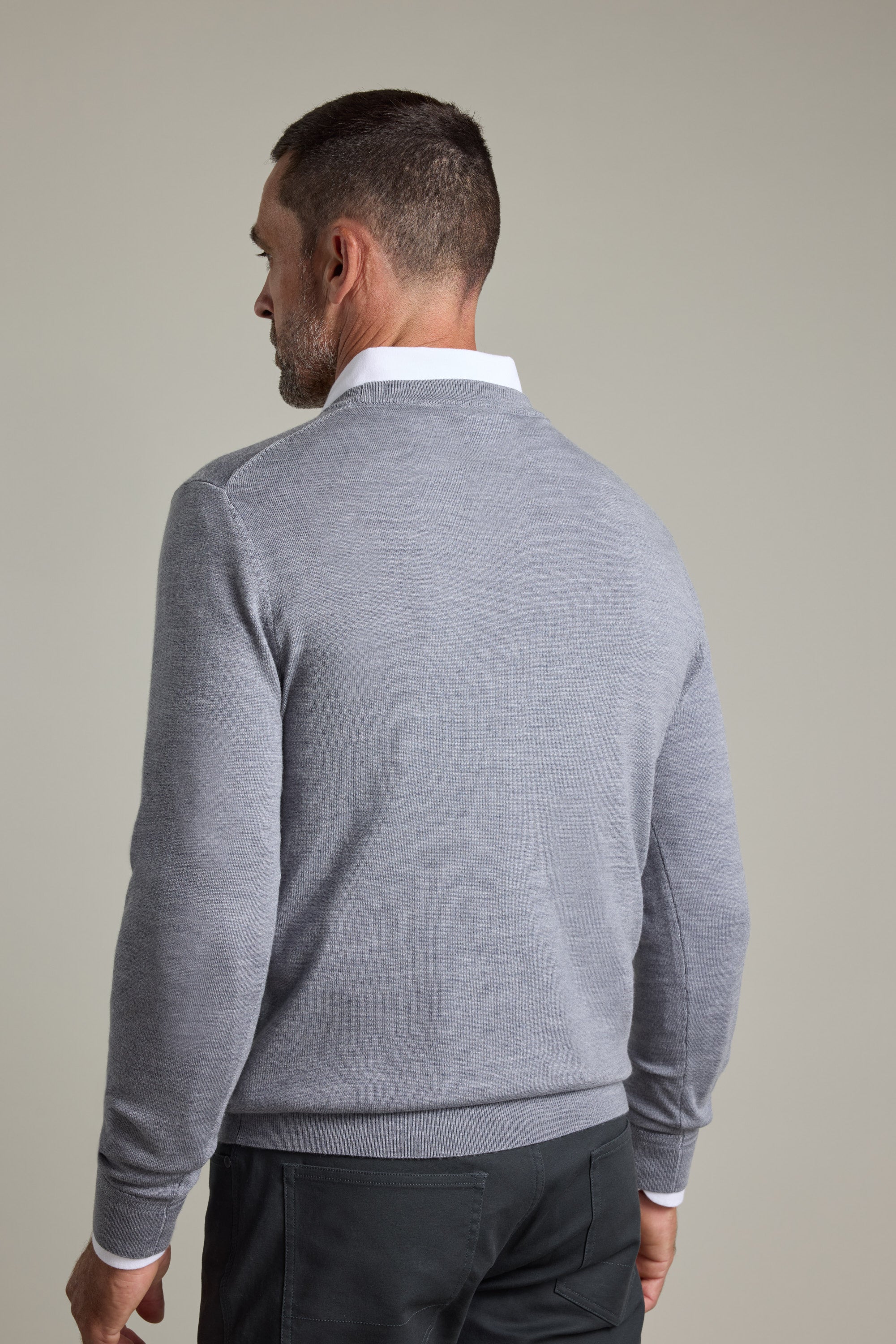 A man in a Barkers Skyland ZQrx Merino Crew seen from the back against a plain background.