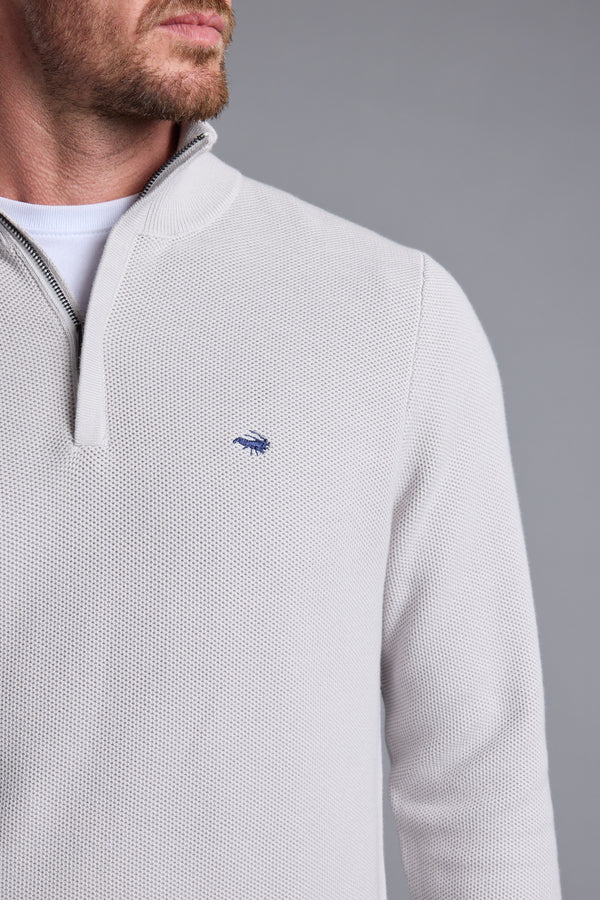 Man wearing a light gray Barkers Gaston Cotton 1/4 Zip Sweater, responsibly sourced cotton.