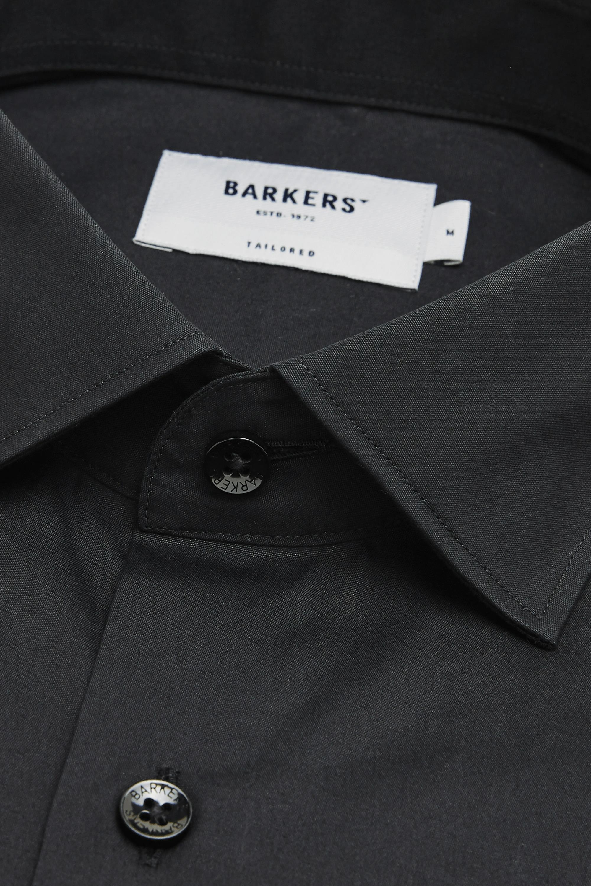 Close-up of a black Tribeca Reg Cuff Shirt by Barkers, featuring two visible buttons, a “Barkers Est. 1972 Tailored” label, and an “M” size tag.