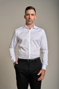 Man wears Barkers Tribeca Reg Cuff Shirt and black pants against a plain background.
