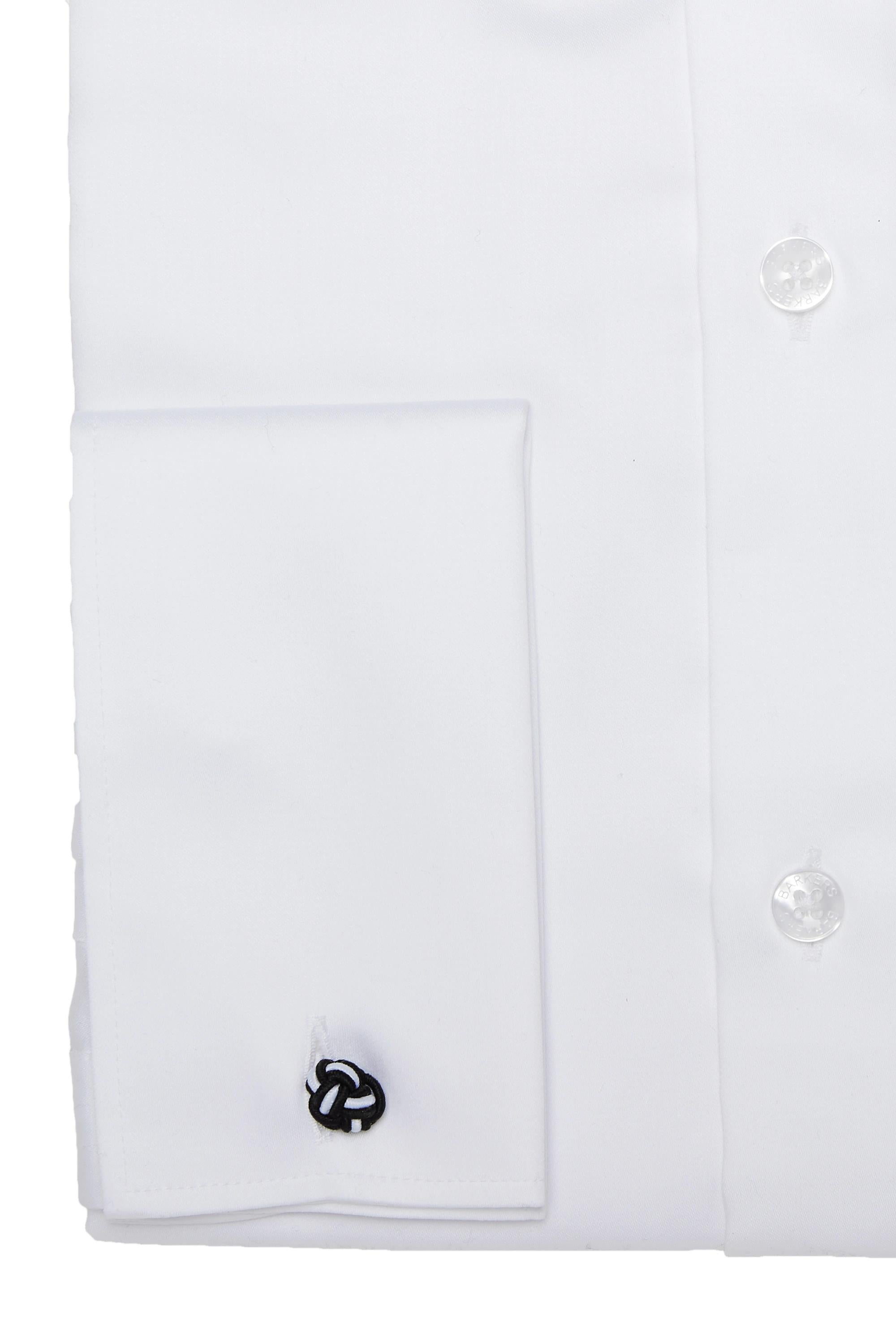 A close-up of the Barkers Tribeca French Cuff Shirt, tailored fit, featuring a French cuff secured by a black and silver knot-style cufflink. Two white buttons are visible on the placket.