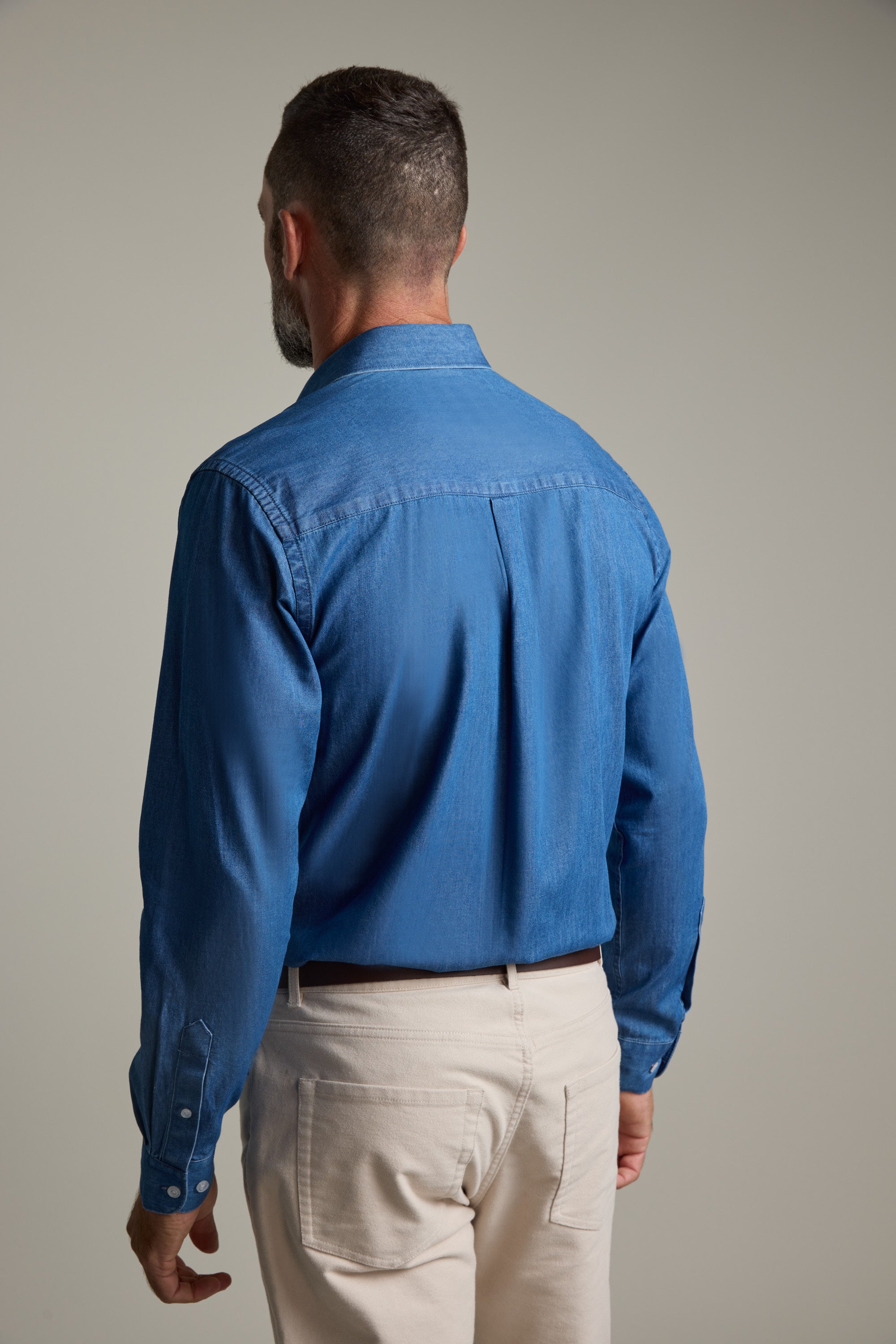 Man wearing Barkers Wyatt Denim Business Shirt, facing away against a plain background.