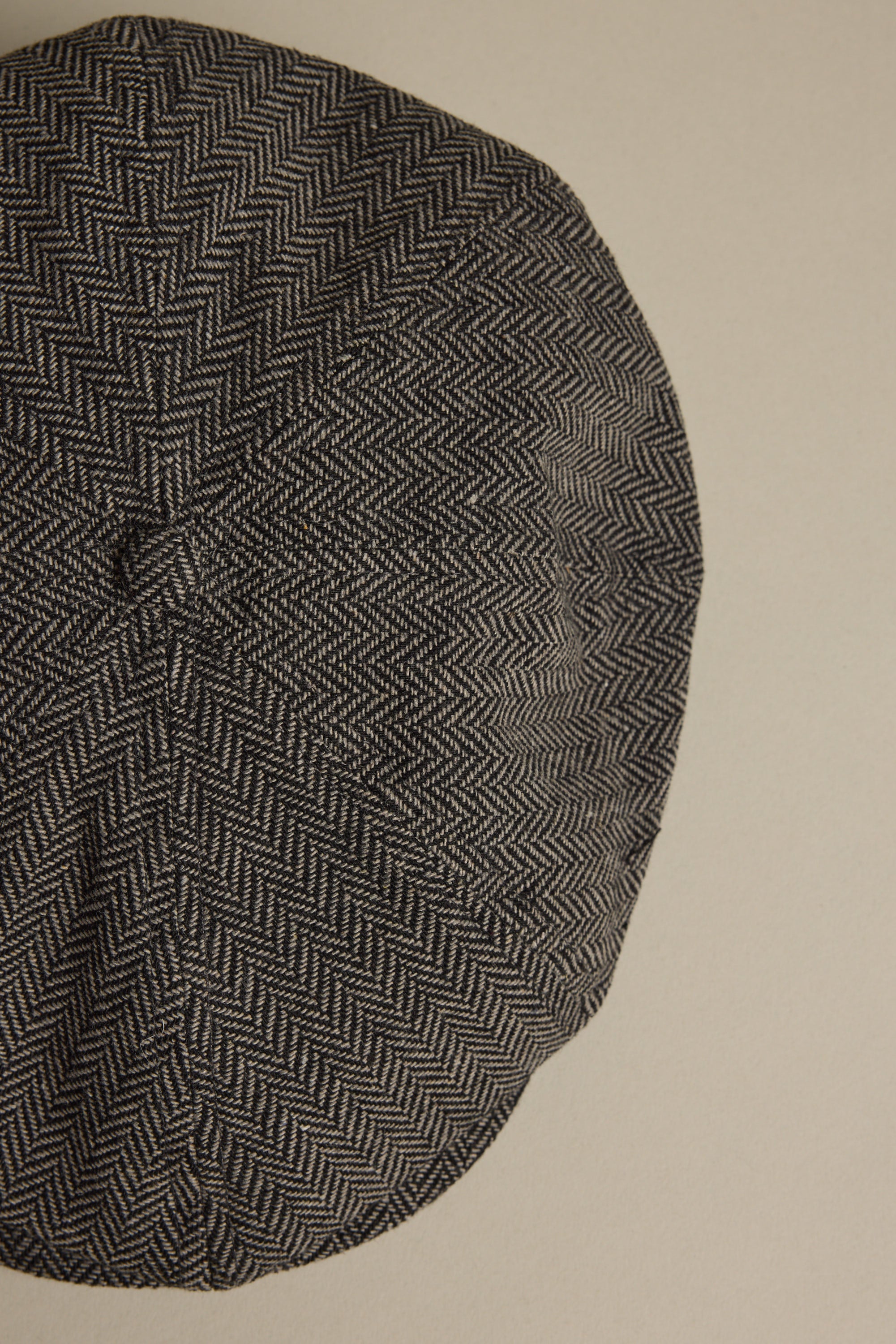 Brixton Brood Snap Cap in gray wool blend, shown from above on a beige background.