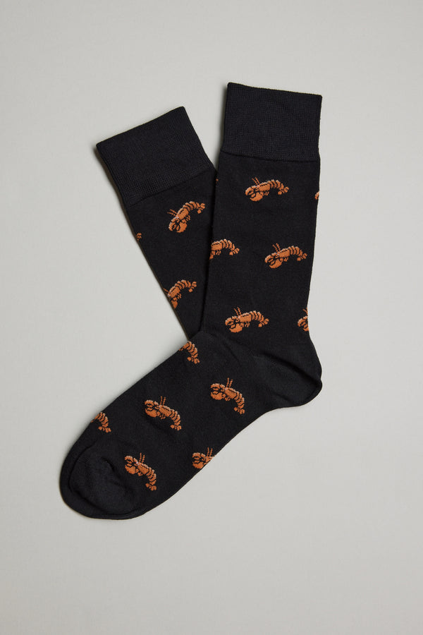 A pair of Barkers Ray Crayfish Socks, featuring an all-over print of small orange lobsters, are laid flat on a light gray background with one comfy sock slightly overlapping the other.