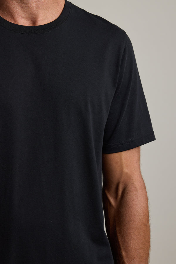 A person wears the Barkers Good Earth Cotton Essential Tee, shown shoulder to mid-torso.