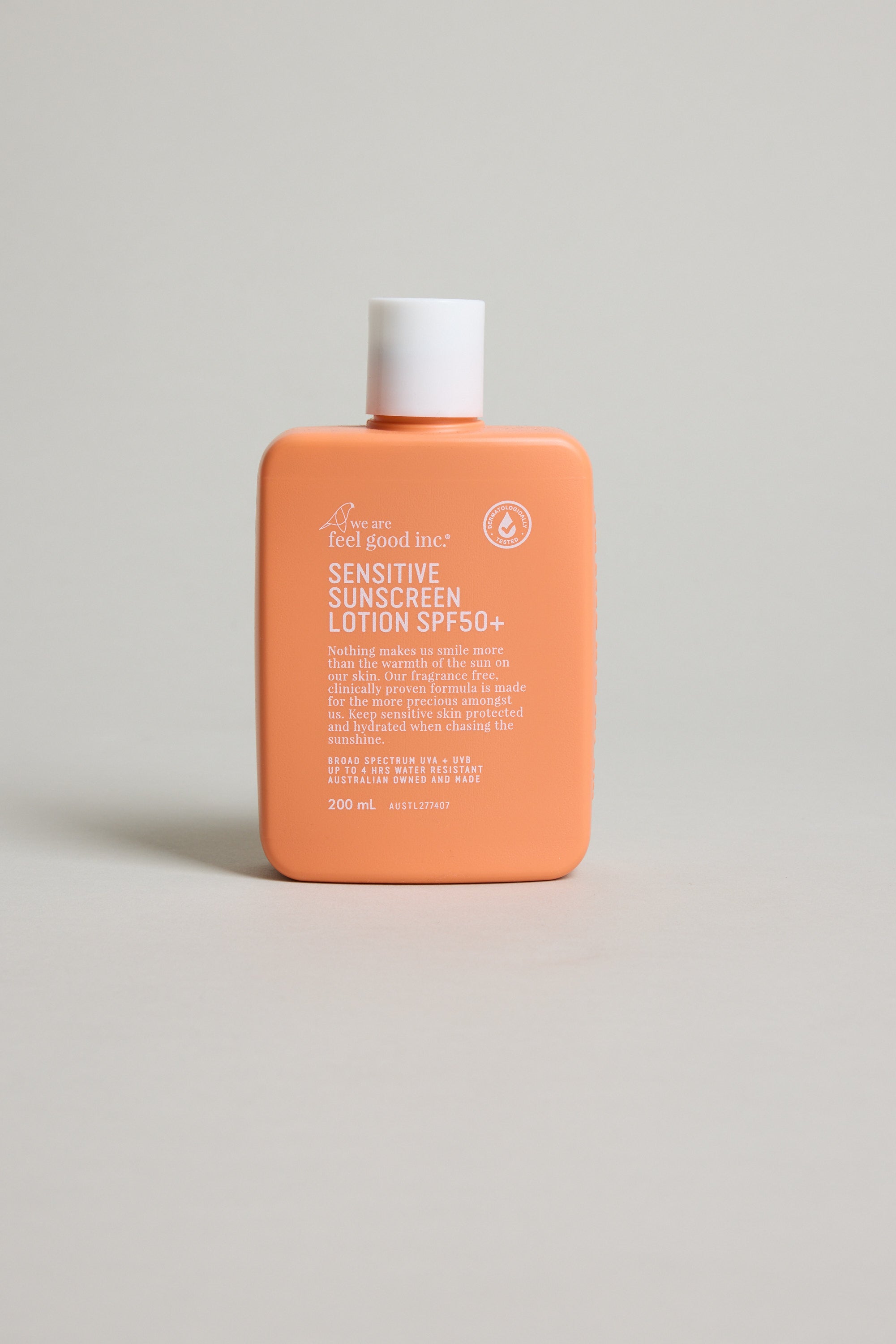 Feel Good Sensitive SPF 50+ by Other, orange bottle, fragrance free, on a light background.