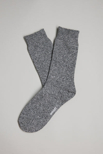 A pair of Barkers Crosby Twist-yarn Socks in gray is laid flat on a light gray background, one overlapping the other—ideal warm boot socks for chilly days.
