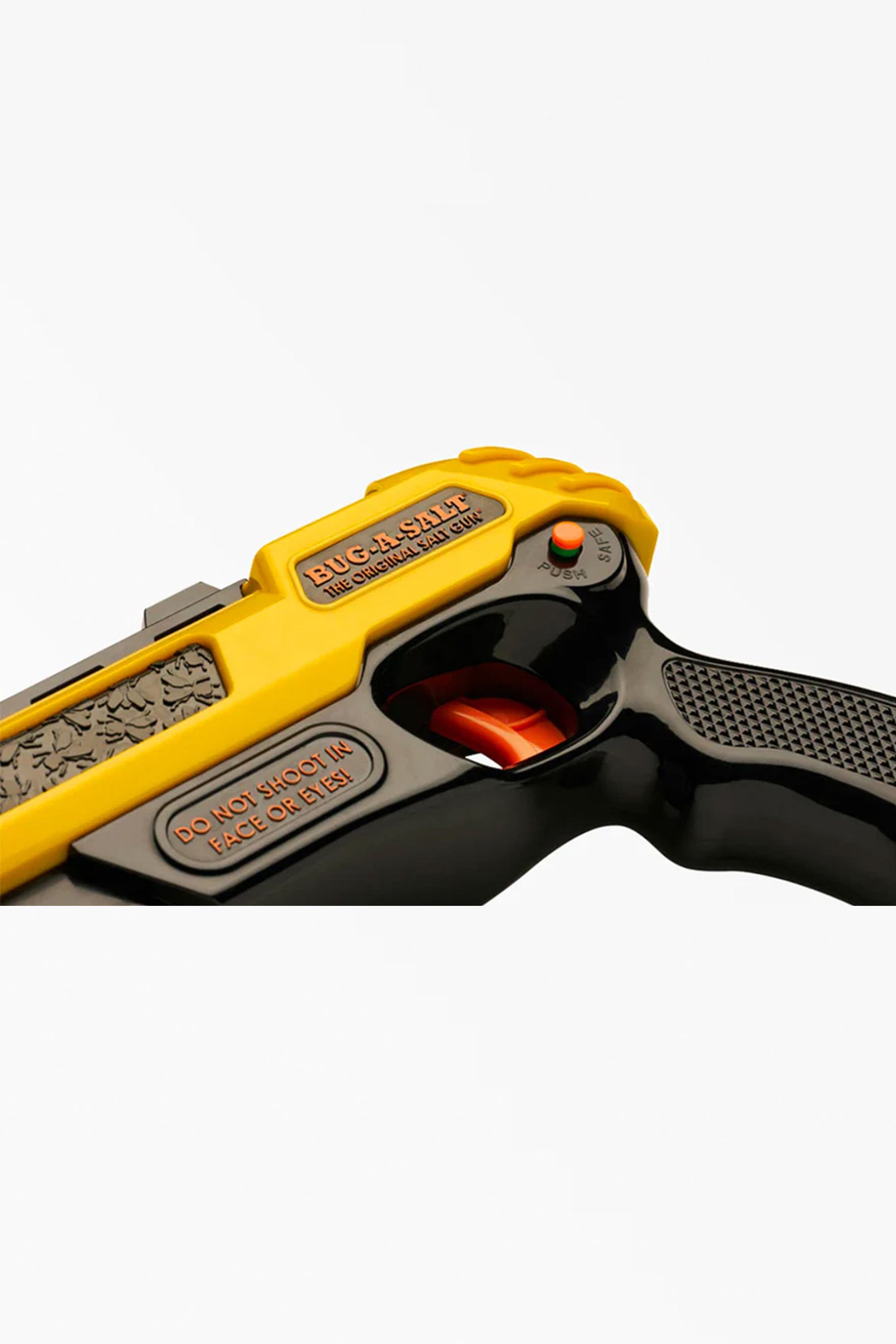Close-up of the Bug-A-Salt 3.0 Black Fly by Other, a yellow and black handheld device with safety instructions and an orange trigger, designed for easy and effective fly elimination.