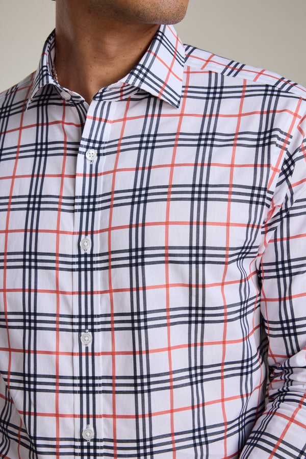 A man wears the Barkers Wilma French Cuff Business Shirt, a wrinkle-free white shirt with a red and navy blue plaid pattern. Only his lower face and upper torso are shown.