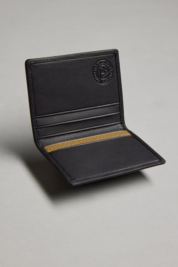 The Barkers Marlin Leather Slim Wallet, crafted from premium cowhide, is open on a flat grey surface, revealing multiple card slots and a tan interior strip. The brand’s circular logo is embossed on the upper right corner.