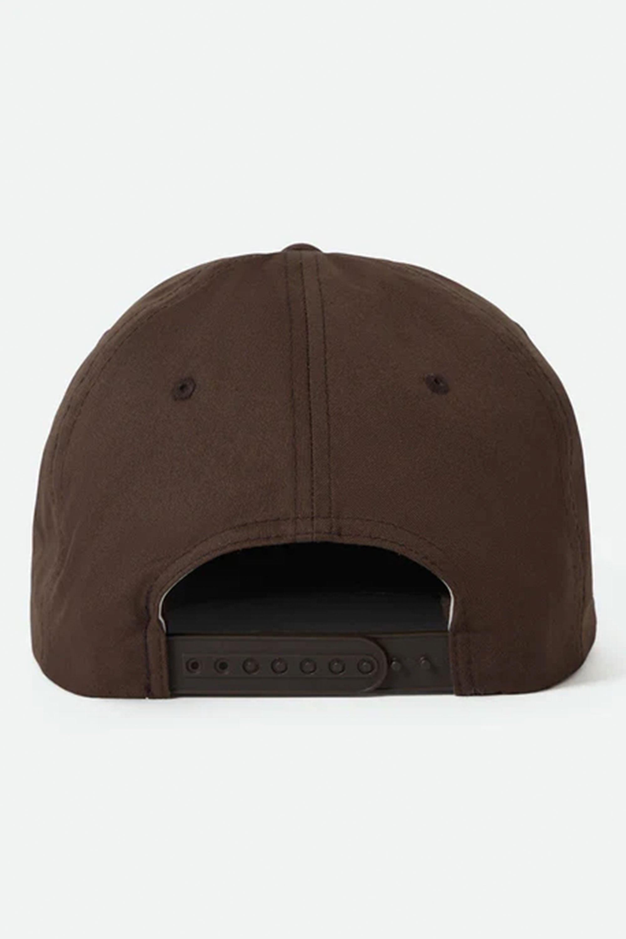 The image features the back view of the Brixton Coleson HP Snapback by Brixton, a brown vintage fit cap with a black adjustable snapback strap and two ventilation eyelets, displayed against a plain white background.