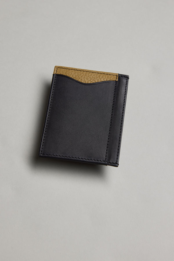 The Barkers Taylor Leather Card Wallet features sustainable black leather with a tan textured accent along the top edge, shown on a light gray surface.